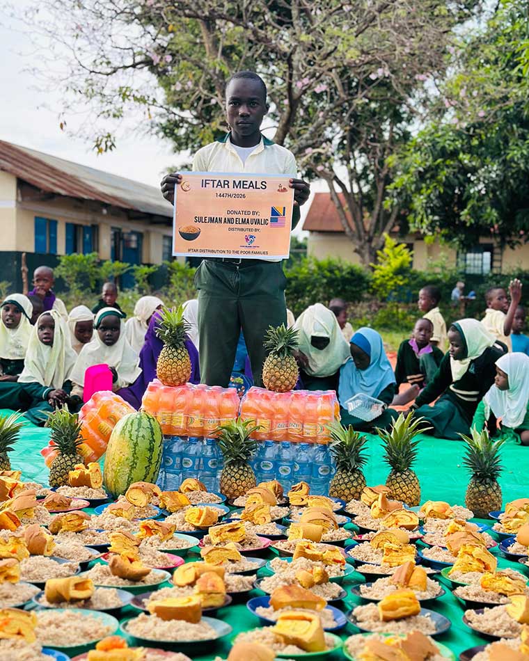 School-boy-holding-a-banner-for-iftar-feeding-programme