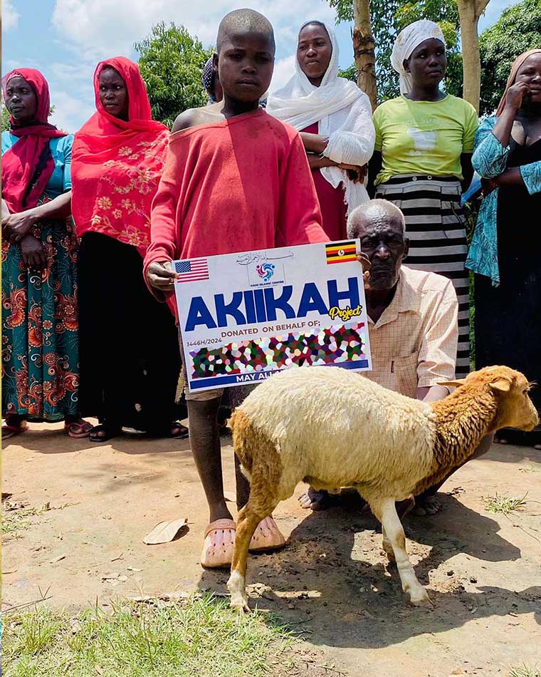a-child-holding-a-flyer-that-reads-'aqiqah'-surrounded-by-comunity-people