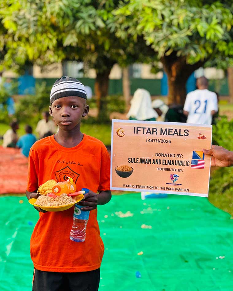 boy-holding-a-palte-of-rice-during-our-feeding-programme