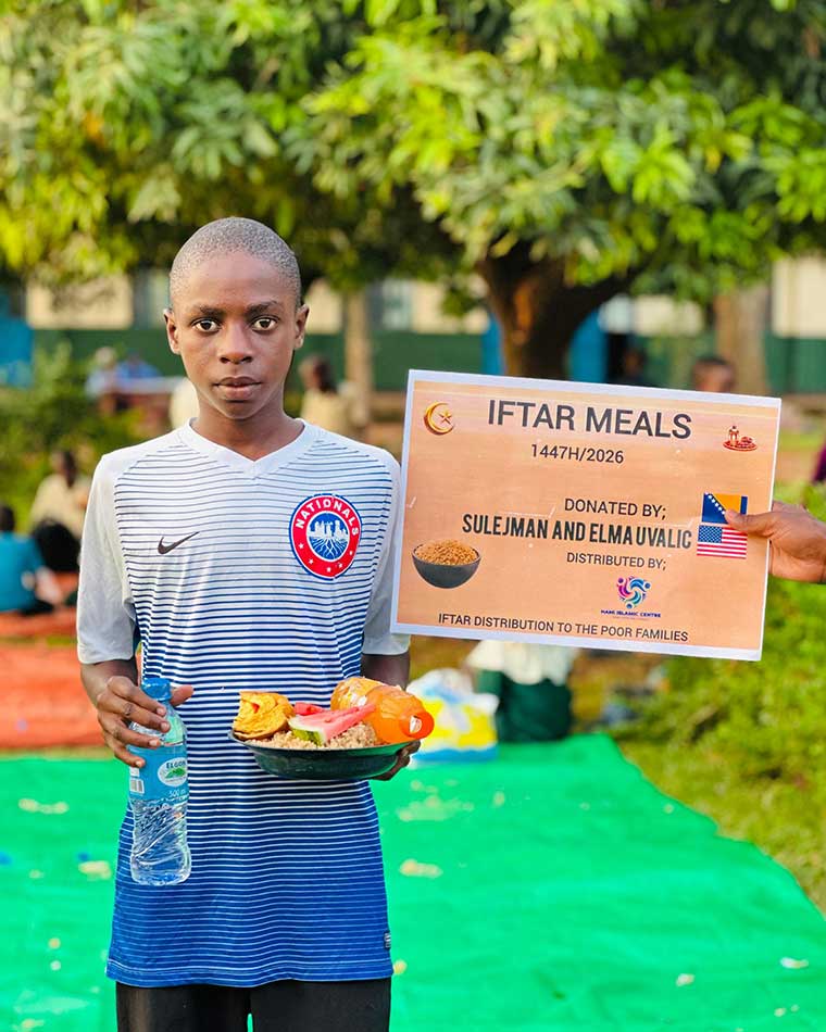 sCHOOL-BOY-HOLDING-A-PALTE-OF-FOOD-DURING-OUR-IFTAR-HOT-MEALS